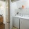 a bathroom with white cabinets