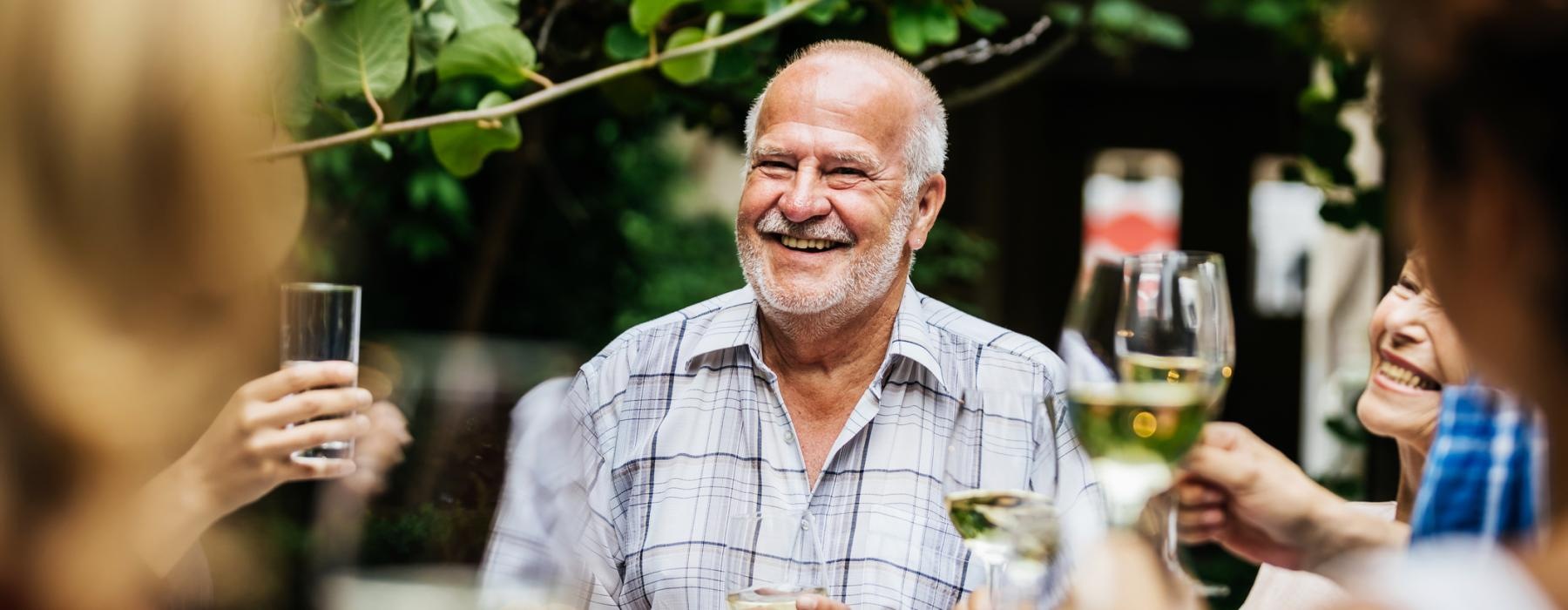 a man holding a glass of wine