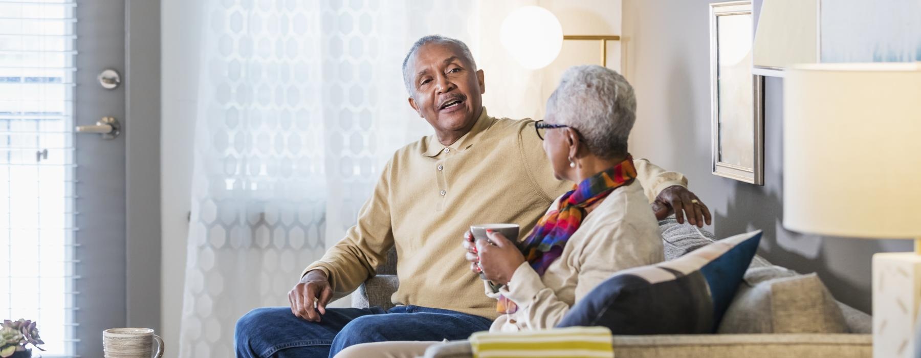 a man and woman sitting on a couch