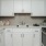 a kitchen with white cabinets